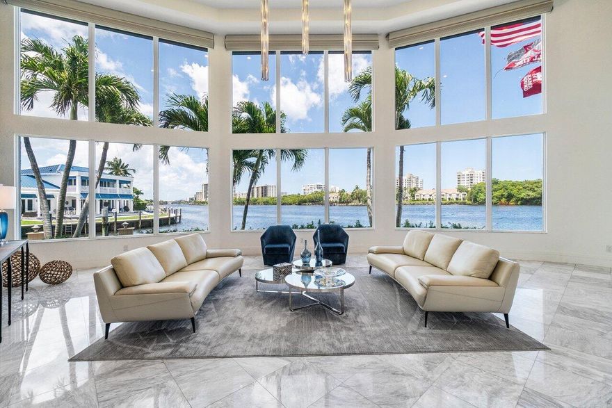 Beautifully Renovated Intracoastal Point Lot with 200 feet of Waterfrontage, dockage for a large yacht and 6649 sq ft under air. Features include new Impact glass doors and windows, 4 new A/C's, Gorgeous kitchen open to the family room and pool, Huge first floor master w/ a stunning bath and fabulous closets, one more ensuite bedroom on the first floor and 3 ensuite bedrooms upstairs. the ''creme de la creme'' is the upstairs living area and the incredible home gym that has been featured in magazines! The is a Crestron whole home audio, video distribution system w/ 10 in touch panels in all rooms and a Lutron lighting system. All of this and the most incredible long and wide Intracoastal views!!