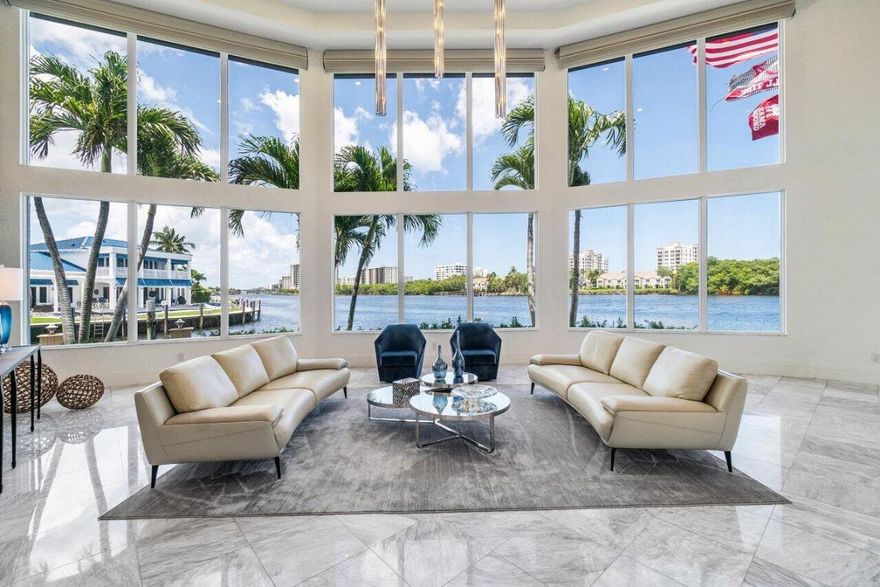 Beautifully Renovated Intracoastal Point Lot with 200 feet of Waterfrontage, dockage for a large yacht and 6649 sq ft under air. Features include new Impact glass doors and windows, 4 new A/C's, Gorgeous kitchen open to the family room and pool, Huge first floor master w/ a stunning bath and fabulous closets, one more ensuite bedroom on the first floor and 3 ensuite bedrooms upstairs. the ''creme de la creme'' is the upstairs living area and the incredible home gym that has been featured in magazines! The is a Crestron whole home audio, video distribution system w/ 10 in touch panels in all rooms and a Lutron lighting system. All of this and the most incredible long and wide Intracoastal views!!