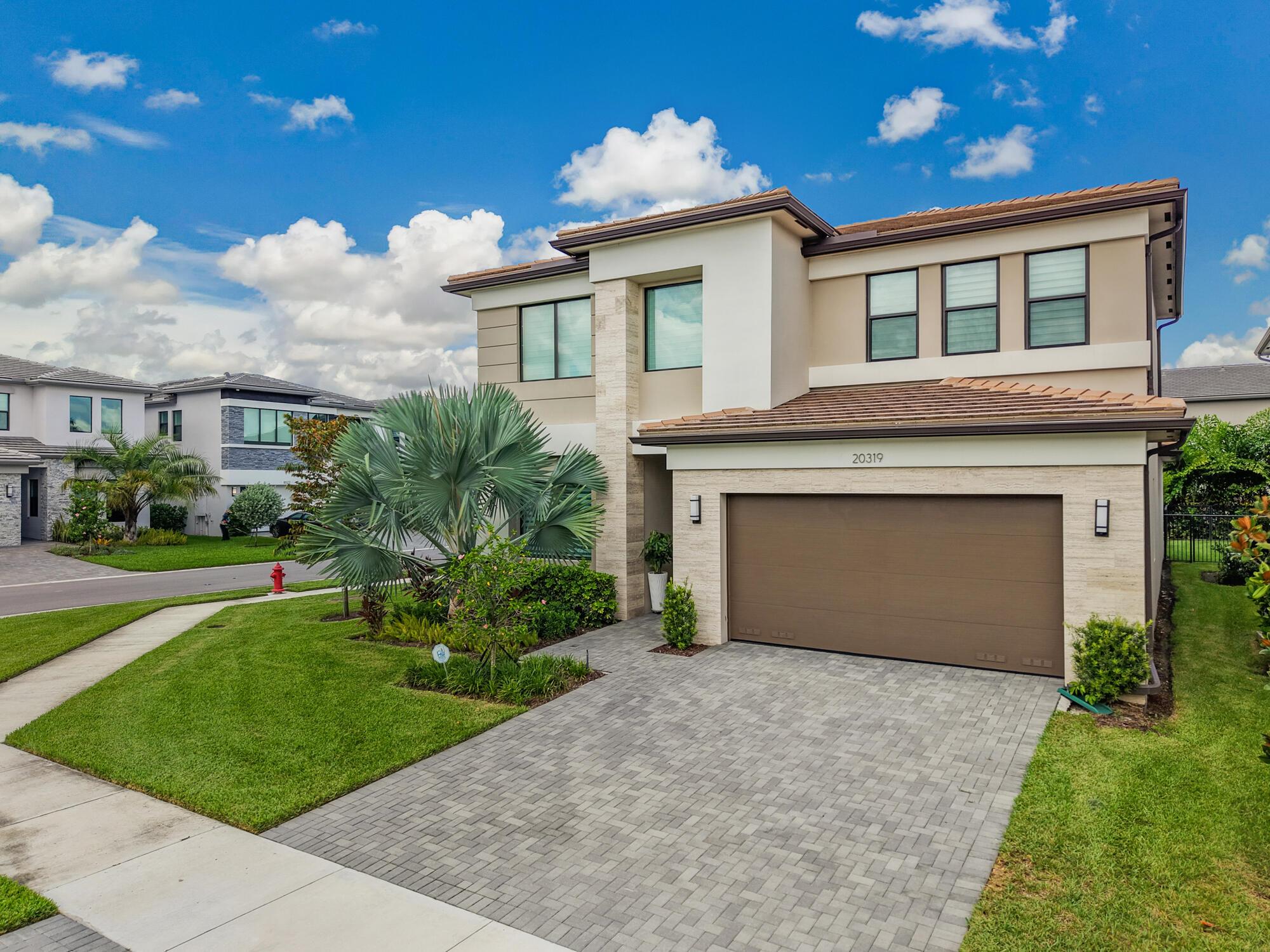 Step into luxury with this exceptional Samoa model residence, offering a resort-style lifestyle in the highly sought-after Lotus Palm community. Boasting 4 bedrooms plus a den/office, loft, 4.5 bathrooms, this stunning home spans approximately 4,094 square feet of thoughtfully designed living space.The heart of the home is the expansive open-concept great room, seamlessly connecting the living, dining, and gourmet kitchen areas--perfect for both effortless entertaining and comfortable everyday living. High-end finishes elevate the space. The first-floor primary suite is a private retreat with direct to access to patio with motorized screen. Upstairs, you'll find three spacious guest suites and a versatile loft living area--ideal for guests or multigenerational living...
