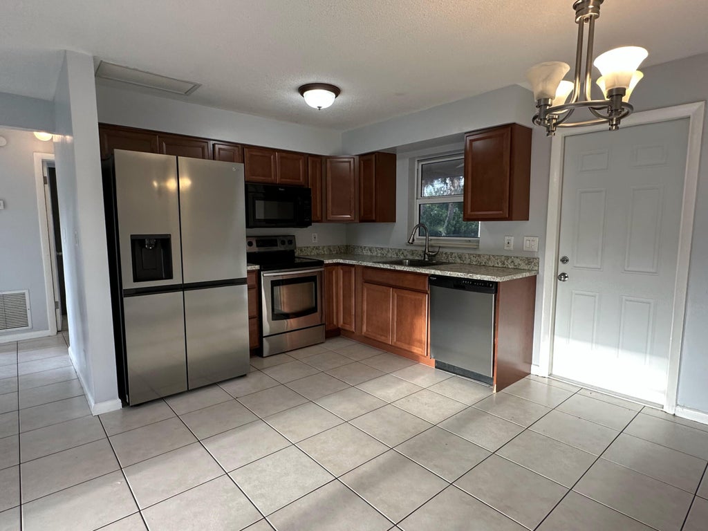 Photo of 8500 Sunset Drive, Palm Beach Gardens, FL 33410 (MLS # B26030506)