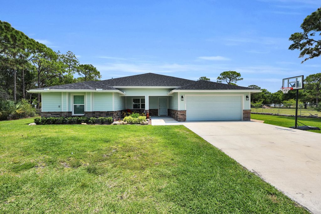 Photo of 5566 Pinetree Drive, Fort Pierce, FL 34982 (MLS # B26024923)
