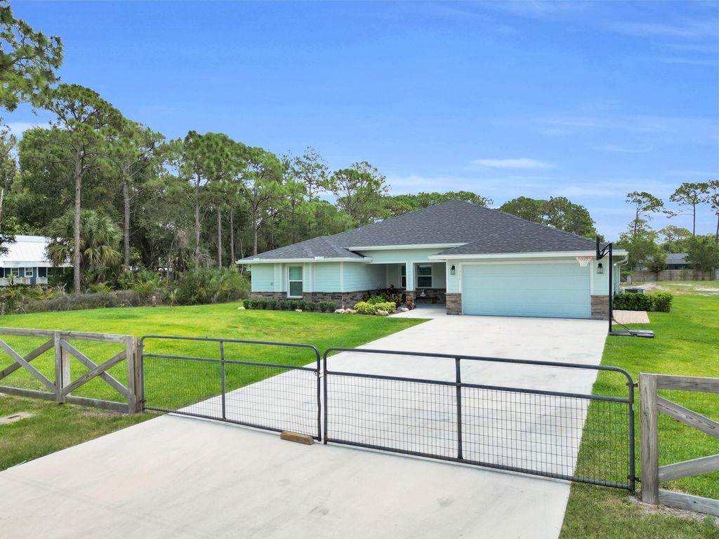 Photo of 5566 Pinetree Drive, Fort Pierce, FL 34982 (MLS # B26024923)