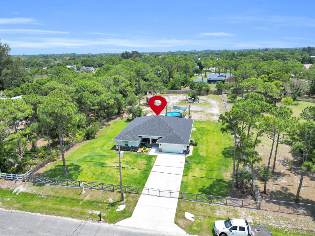 Photo of 5566 Pinetree Drive, Fort Pierce, FL 34982 (MLS # B26024923)