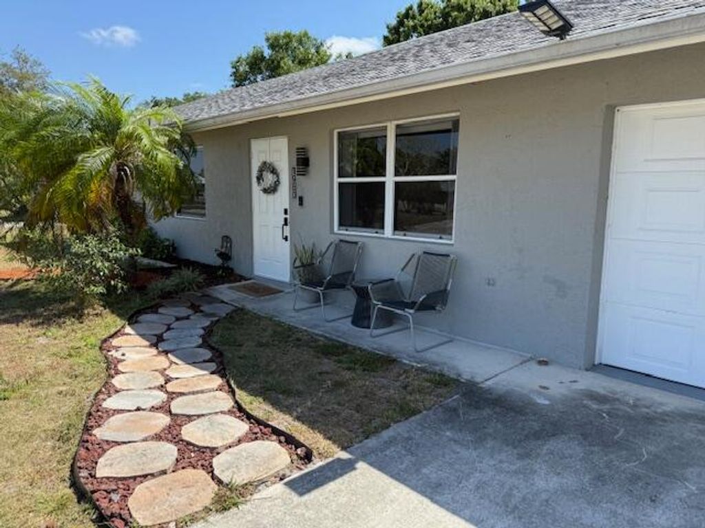Photo of 1951 SW Agnes Street, Port Saint Lucie, FL 34953 (MLS # B26028080)