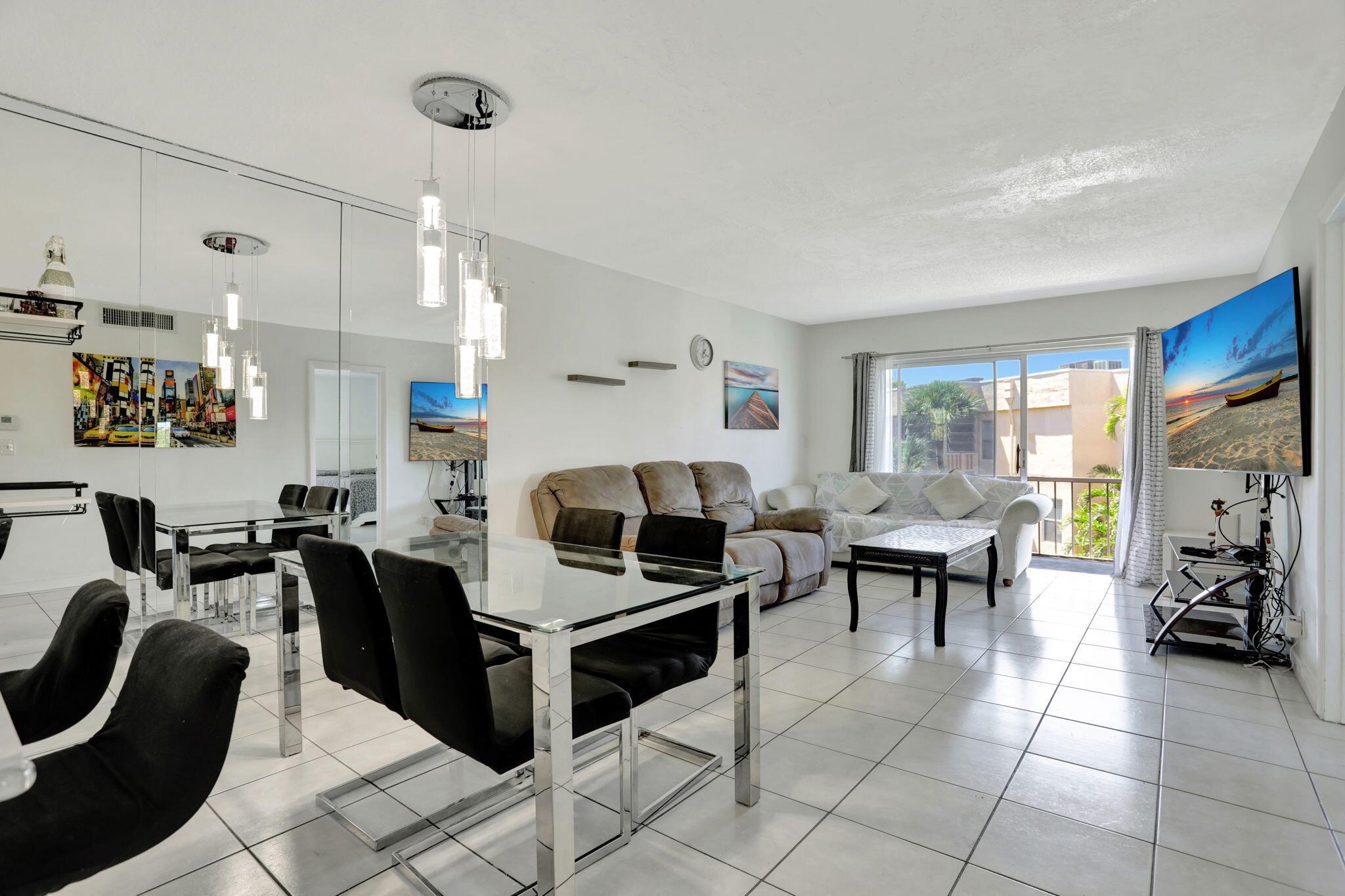 Bright & Spacious 2/2 Corner Unit in a 55+ Community!This top-floor gem offers a beautifully updated, open kitchen with sleek stainless-steel appliances including a refrigerator and cooktop stove. Enjoy the breeze from your screened-in balcony. Tile flooring throughout the living area, luxury laminate floors in bedroom and walk-in closet in the master suite. Close proximity to the community pool and conveniently located near shopping dining, major roads, and the hospital.