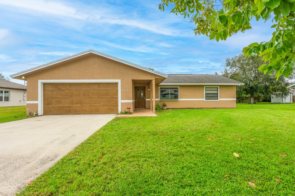 Photo of 602 NW Archer Avenue, Port Saint Lucie, FL 34983 (MLS # R11134804)