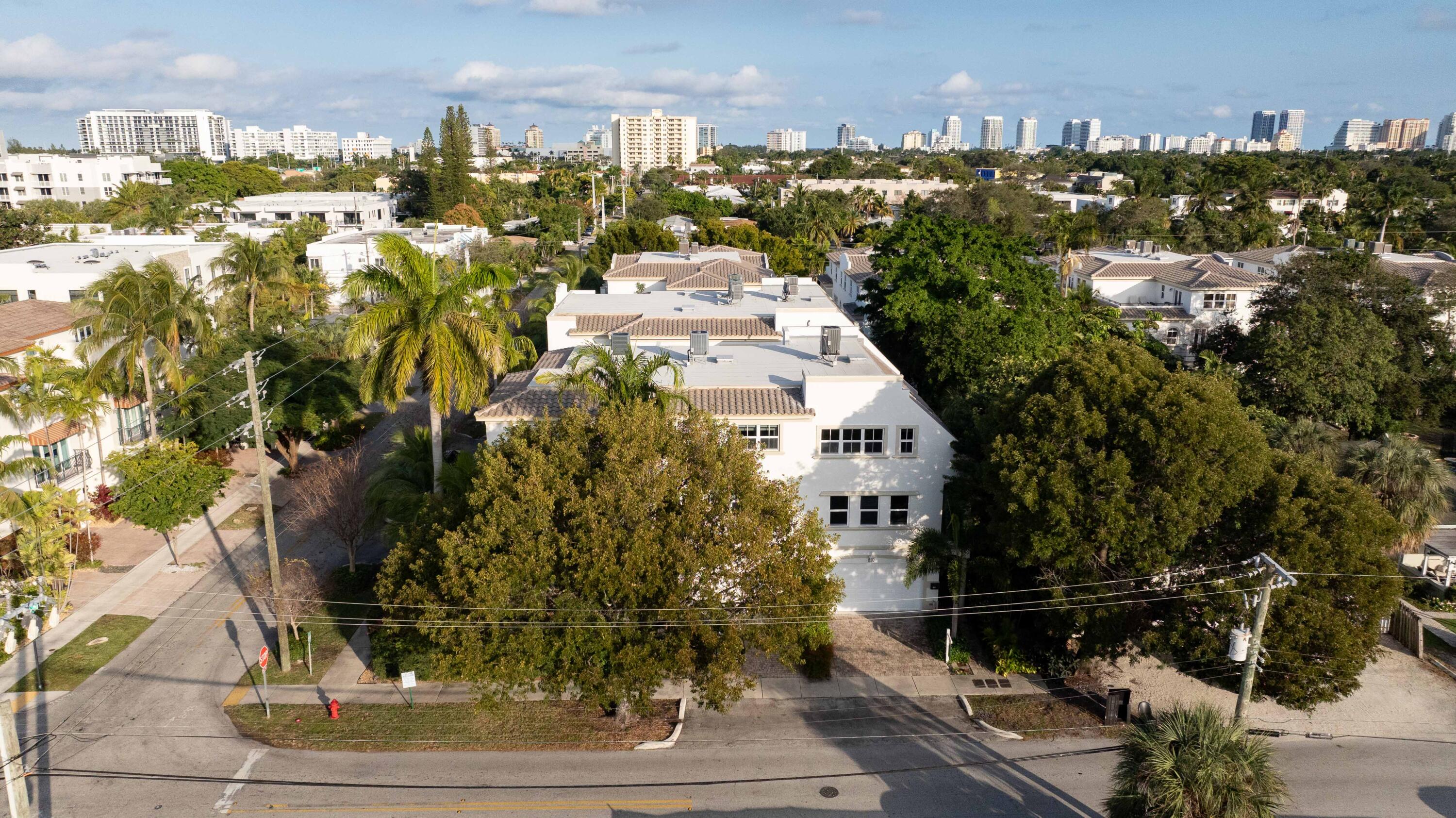 Less than 5 min to new pickleball courts & Panthers facility, under 10 to Las Olas, downtown, Dog Beach & surf. Inside: flexible layout--easily add a 3rd bedroom with barn doors. Brand-new roof, AC, paint, impact windows, tankless water heater & sprinklers on all 3 floors. Built-in wine cellar. Lawn care included--ideal for lock-and-leave living. All assessments paid, no flooding. Designer furniture, globally curated, is negotiable for a truly turnkey home.