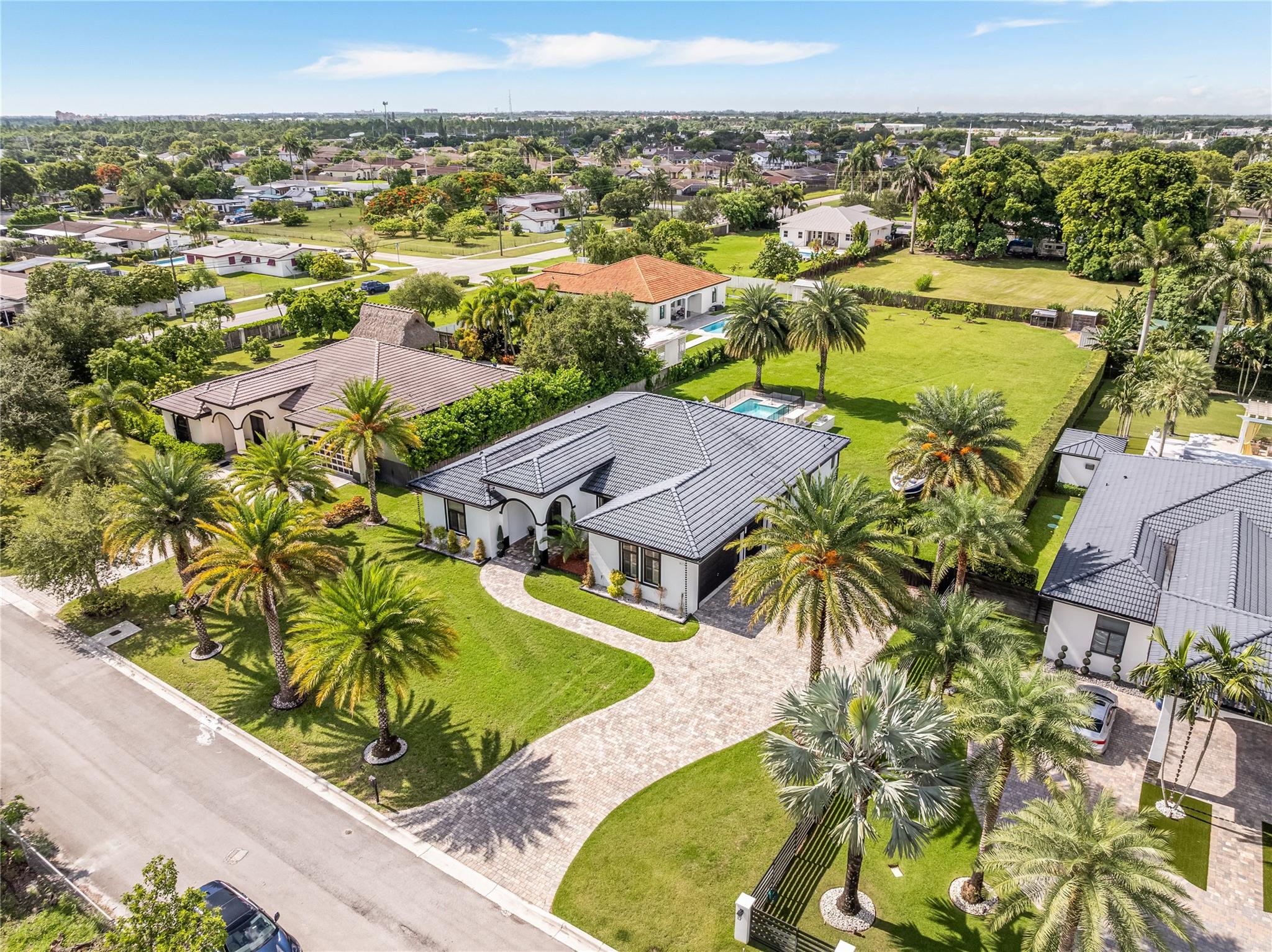 Recently appraised at $1.2 million, don’t overpay! This stunning 5 bed, 3 bath estate sits on an enormous 35,994 Sq. Ft. lot, nearly 1 acre, with no HOA. Located in the exclusive Arbor Estates community, this single story gem features over 2,700 Sq. Ft. of open-concept living, a huge driveway, and a 3-car garage. Step inside to find luxurious, updated finishes, a gorgeous master suite, and a spa-like master bathroom. Enjoy year-round comfort with two new A/C units. Outside, unwind by your resort-style pool and enjoy a spacious backyard with fruit trees and endless room to entertain, expand, or park your boat or RV. All impact windows and doors offer peace of mind. One of Homestead’s most desirable neighborhoods, with top-rated schools and true privacy, this home is the total package!