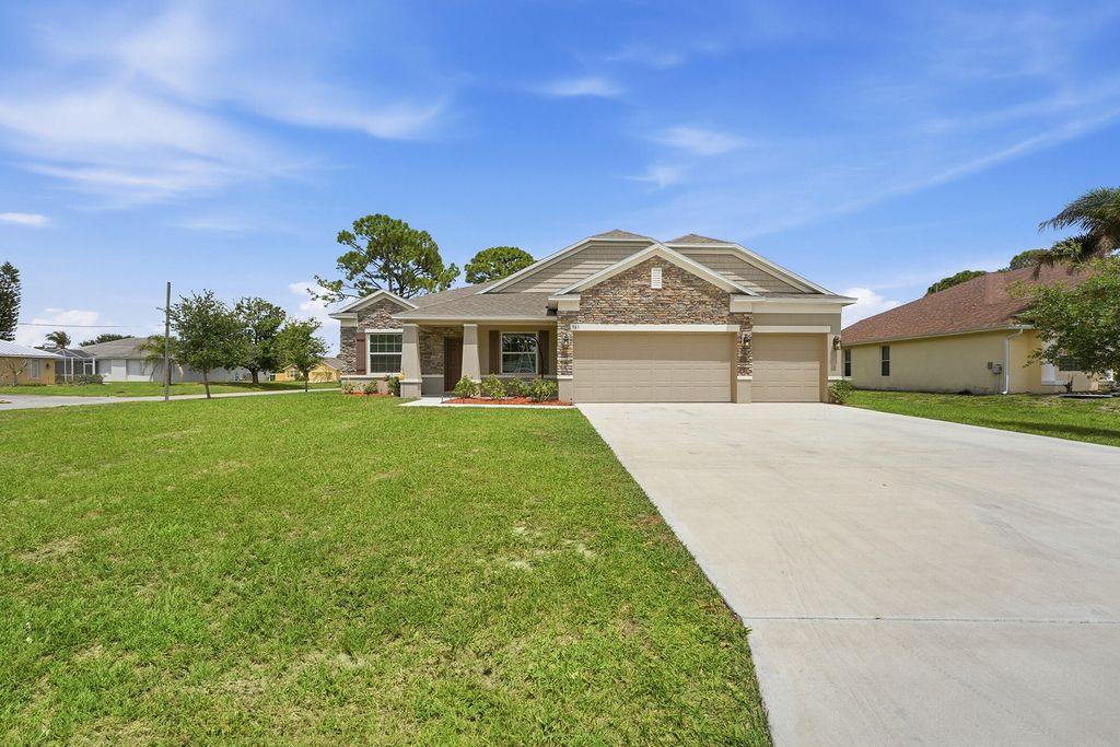 Photo of 963 SW Cecil Lane, Port Saint Lucie, FL 34953 (MLS # B26016274)