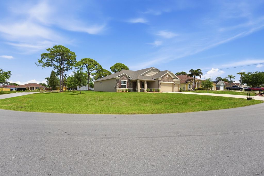 Photo of 963 SW Cecil Lane, Port Saint Lucie, FL 34953 (MLS # B26016274)