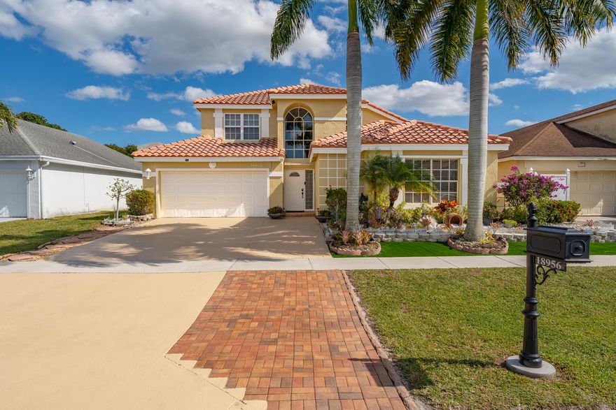 Beautifully updated 4-bedroom +bonus room, 2.5-bath home located in the desirable West Boca Raton. The spacious primary suite and renovated bath are conveniently located on the first floor, along with a guest half bath and a versatile bonus room—ideal for a home office or guest room-offering excellent privacy and flexibility.Upstairs has a loft, three additional bedrooms & a bathroom.Enjoy a huge screened patio overlooking a lush backyard filled with mature fruit trees, perfect for relaxing or entertaining. This home features a 2-car garage plus a large driveway with ample parking. Hurricane protection with impact windows provides added peace of mind. Located in sought-after Boca Landings, low HOA community offering resort-style amenities, cable, pool, tennis, basketball, pickleball+more
