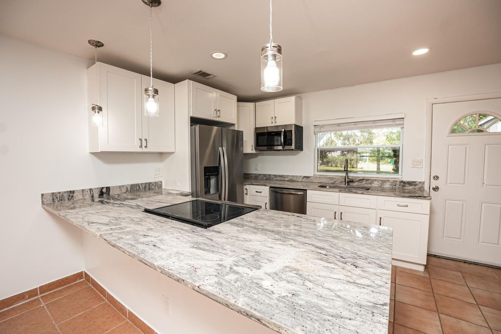 Photo of 402 SW Ruffner Court, Port Saint Lucie, FL 34953 (MLS # B26013512)