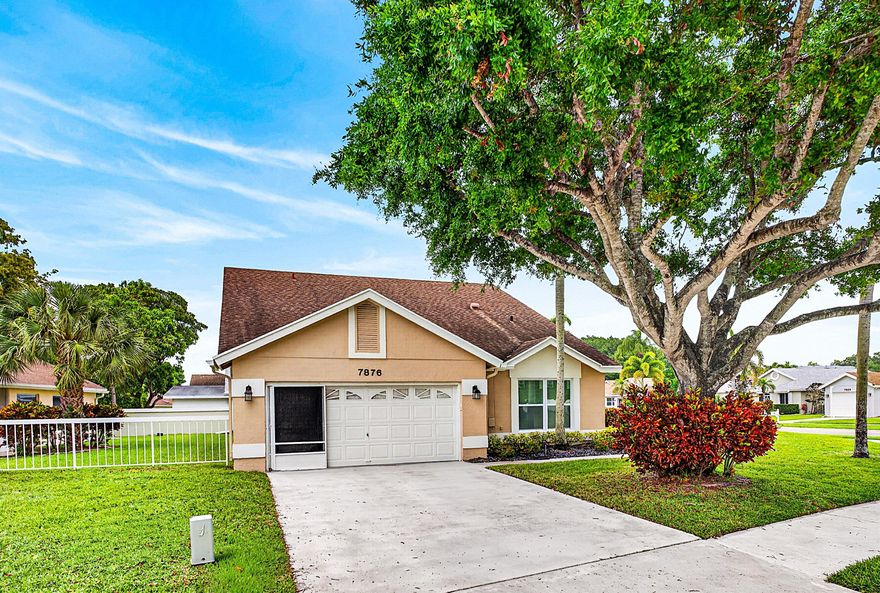Beautifully remodeled 3-bedroom, 2-bath single-family home with 2-car garage in the 55+ community of Pine Ridge at Delray. Set on a large corner lot directly across from the pool and tennis courts, this bright, open-concept home features designer custom finishes, cathedral ceilings, recessed LED lighting, wood-look porcelain tile, and all-new impact windows and doors. The gourmet kitchen offers hand-made custom cabinetry, stone countertops, and stainless steel appliances. The primary suite features vaulted ceilings, outfitted walk-in closet, and spa-inspired bath with custom glass zero-entry shower. Two additional bedrooms offer flexible guest/office space. The insulated, air-conditioned garage includes wall-to-wall cabinetry—ideal for a craftsman, hobbyist, or extra storage. Pine Ridge of Delray amenities include a clubhouse, two pools, hot tubs, tennis, shuffleboard, bingo, yoga, and an exercise room. The low HOA fee covers exterior house painting, lawn care, driveway and walkway pressure washing, common area maintenance, exterior pest and weed control, basic ADT security, and front tree trimming where owned by the HOA. Excellent location in a growing area near Delray Marketplace, shopping, dining, movies, downtown Delray Beach, the beach, and the Florida Turnpike.