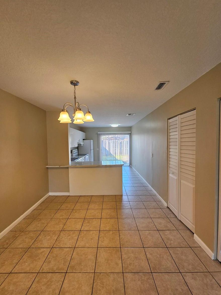 Completely renovated and freshly painted 3-bedroom, 2-bathroom townhouse offering 1,320 SqFt of stylish, move-in-ready living space. This home features a modern kitchen with beautiful cabinetry and updated appliances, along with fully renovated bathrooms showcasing contemporary finishes. Ceramic tile flooring throughout, smooth knockdown ceilings with no popcorn, and stylish ceiling fans enhance the home's clean, modern feel. Ideally located just minutes from the Turnpike, I-95, and downtown, with easy access to shopping, dining, and entertainment. A true turnkey opportunity not to be missed.