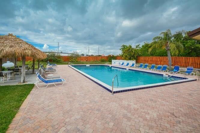 MUST SEE! Love the location of this Villa. Beautifully updated ground floor Villa in Hobe Sound-Pet friendly and Move-In ready. This light and bright 2 bedroom/2bath Villa has been tastefully updated throughout, including the kitchen and both bathrooms. Enjoy easy-care tile flooring in all living areas, a spacious layout, and the convenience of a full-size washer & dryer inside the unit. Relax on the charming front porch or covered fenced back patio. Accordion shutters provide added peace of mind. Just minutes from stunning beaches, shopping and dining. Come enjoy the best of coastal living. This is a 55+ community.