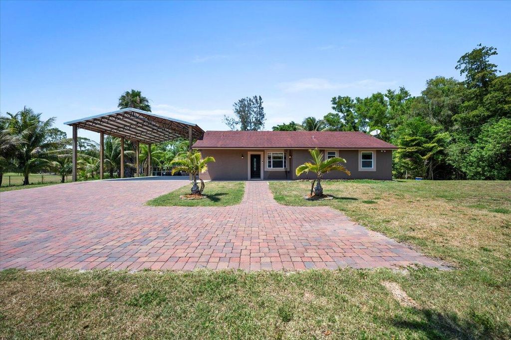 Photo of 11819 Tangerine Boulevard, West Palm Beach, FL 33412 (MLS # R10986104)