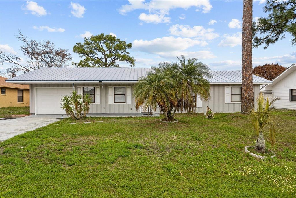 Photo of 949 SE Breakwater Avenue, Port Saint Lucie, FL 34983 (MLS # B26003938)