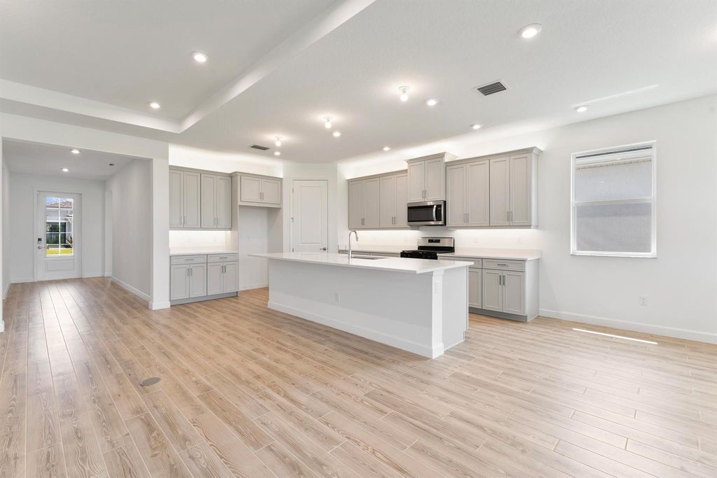 Photo of 9817 SW Isabelline Drive, Port Saint Lucie, FL 34987 (MLS # R10899419)