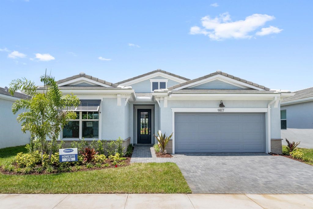 Photo of 9817 SW Isabelline Drive, Port Saint Lucie, FL 34987 (MLS # R10899419)