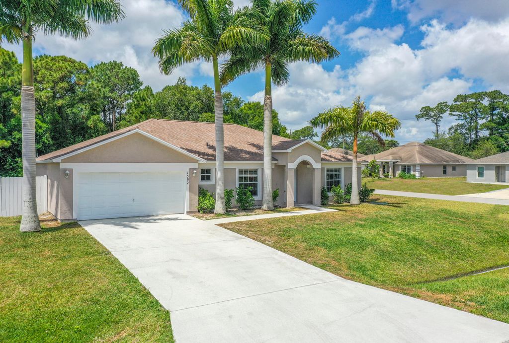 Photo of 1592 SW Dow Lane, Port Saint Lucie, FL 34953 (MLS # R10986880)