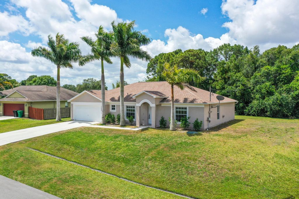Photo of 1592 SW Dow Lane, Port Saint Lucie, FL 34953 (MLS # R10986880)