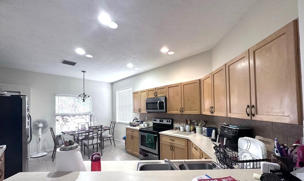 Photo of 840 SW Rocky Bayou Terrace, Port Saint Lucie, FL 34986 (MLS # R10934873)