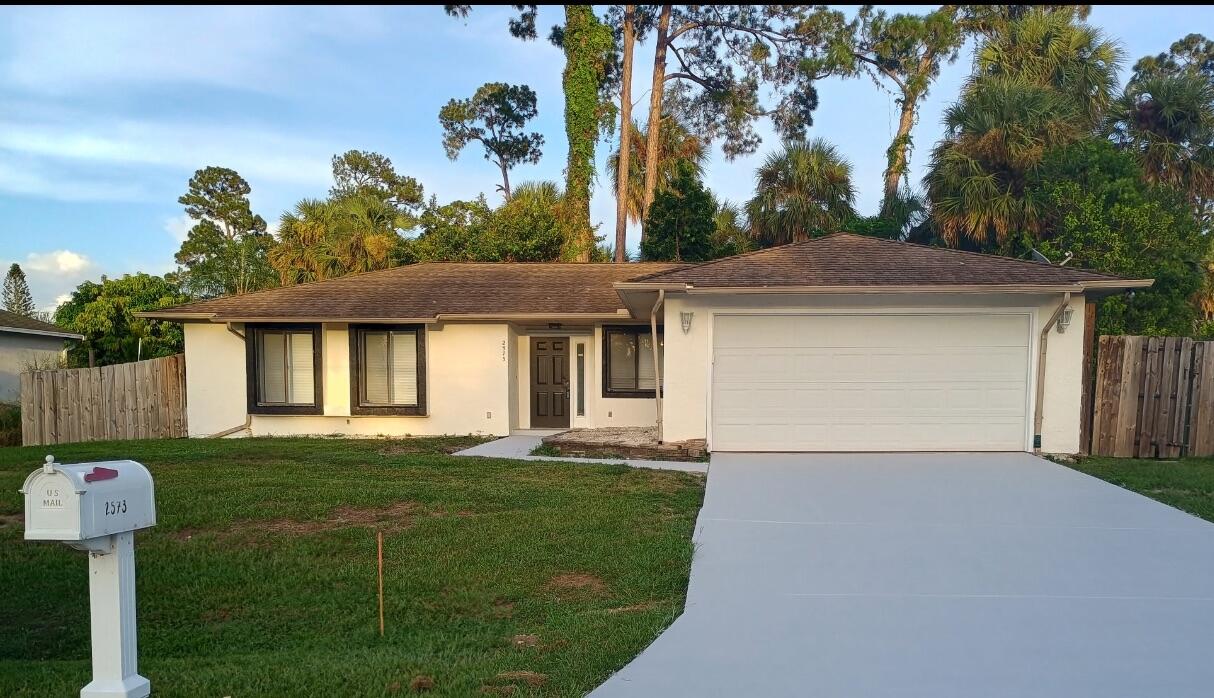 Photos coming soon. **NEW ROOF** with accepted offer, **NO HOA**, and a .24-acre lot in one of Port St. Lucie's most desirable areas! Bring your boat, RV, or extra vehicles to this 3-bedroom, 2-bath, 2-car garage home offering 1,428 sqft of living space. New A/C in 2021, including all new ductwork. LVP flooring throughout. Enjoy a spacious, fenced backyard--perfect for a pool. Pick Avocados from your own tree! A large screened patio is ideal for relaxing or entertaining. Just minutes to top-rated schools, shopping, dining, and major highways. Only 10 minutes to Tradition and Cleveland Clinic, and less than 30 minutes to the beach. Move-in ready and full of value--schedule your private tour today!