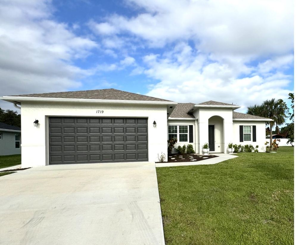 Photo of 1719 SW Bradway Lane, Port Saint Lucie, FL 34953 (MLS # B26035366)