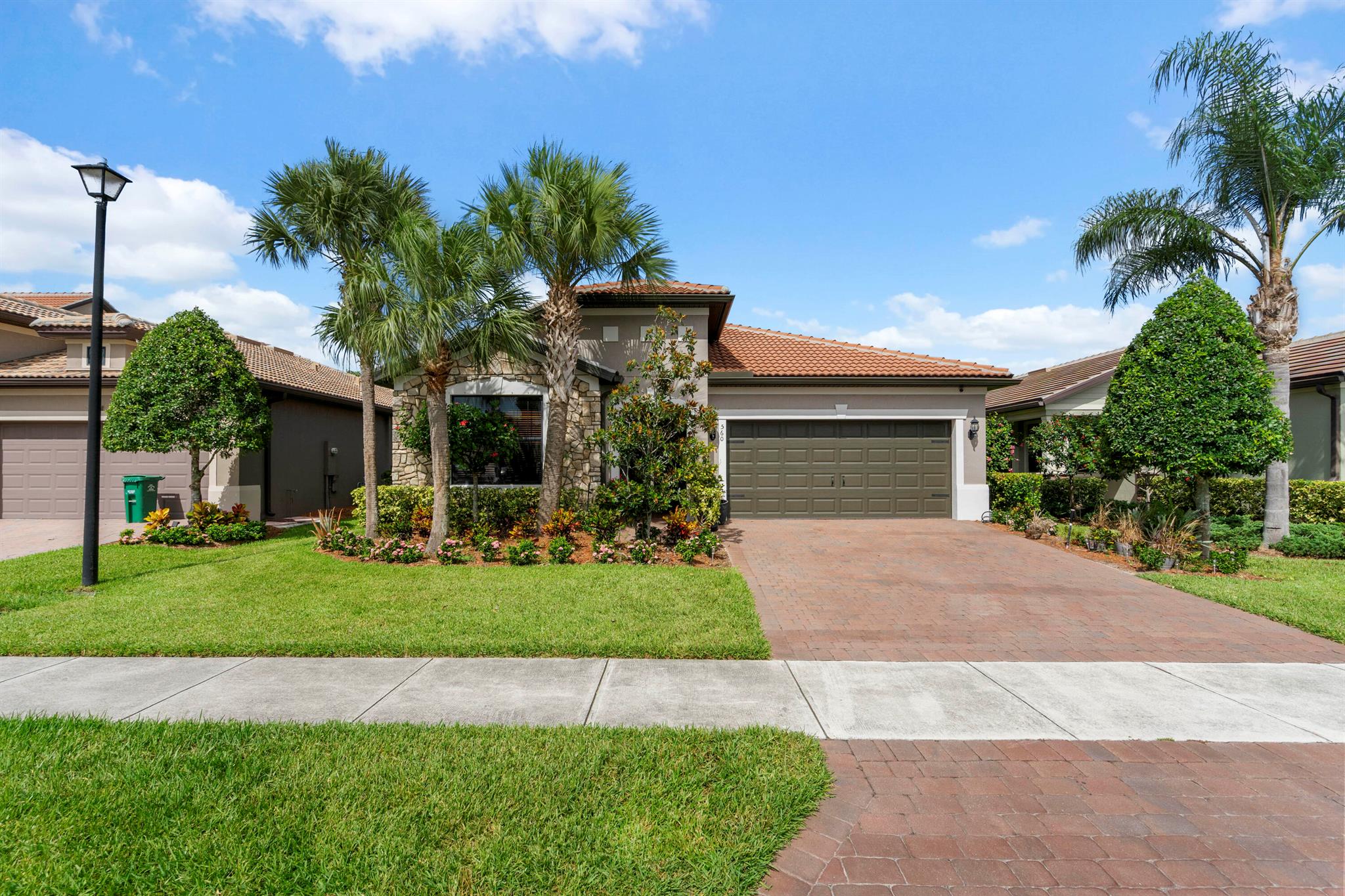 MOVE RIGHT IN! Gorgeous 3BR+Flex/2BA/2CG home with numerous upgrades and a private fenced yard in Veranda Gardens! This home features tile flooring throughout, plantation shutters, glass entry front door, NEW A/C, fresh exterior paint, pantry with custom shelving, screened & partially covered patio, additional flex space/office nook and more. The spacious white kitchen features a large center island, SS appliances, pendant lighting, tiled backsplash, granite counters, a gas range and large pantry. Open floor plan ideal for modern living. Master suite has views of the back yard as well as an ensuite with dual sinks, tiled shower and walk-in closet. Two guest bedrooms have access to a hall bathroom. The fully fenced and private back yard is a great spot for your furry family members.