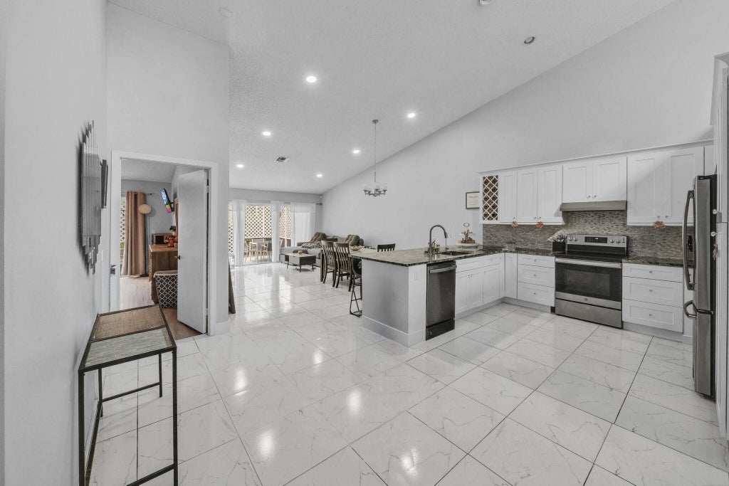 Photo of 3575 Deer Creek Palladian Circle, Deerfield Beach, FL 33442 (MLS # B26091024)