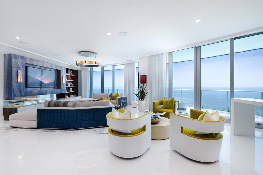 Seldom available SE Corner, 4BR condo in premier Oceanfront tower. Residence 1401 boasts exceptional design, capturing the Ocean's essence and awe-inspiring panoramas. Your private entrance welcomes you to a home adorned with bespoke finishes and upgrades: custom built-ins, lighting, motorized shades, closets, bar, sound system and much more. If you are looking for a model home, you have found it! Floor-to-ceiling glass transitions to expansive wraparound covered terrace, offering superb outdoor living. Amenities encompass coffee/newspaper lounge, steam and massage rooms, his/hers saunas and showers, yoga studio, well-equipped gym with Peloton zone, BBQ spot, stunning oceanfront infinity pool with hot tub & beach service. Long-term rentals only; Ample reserves.