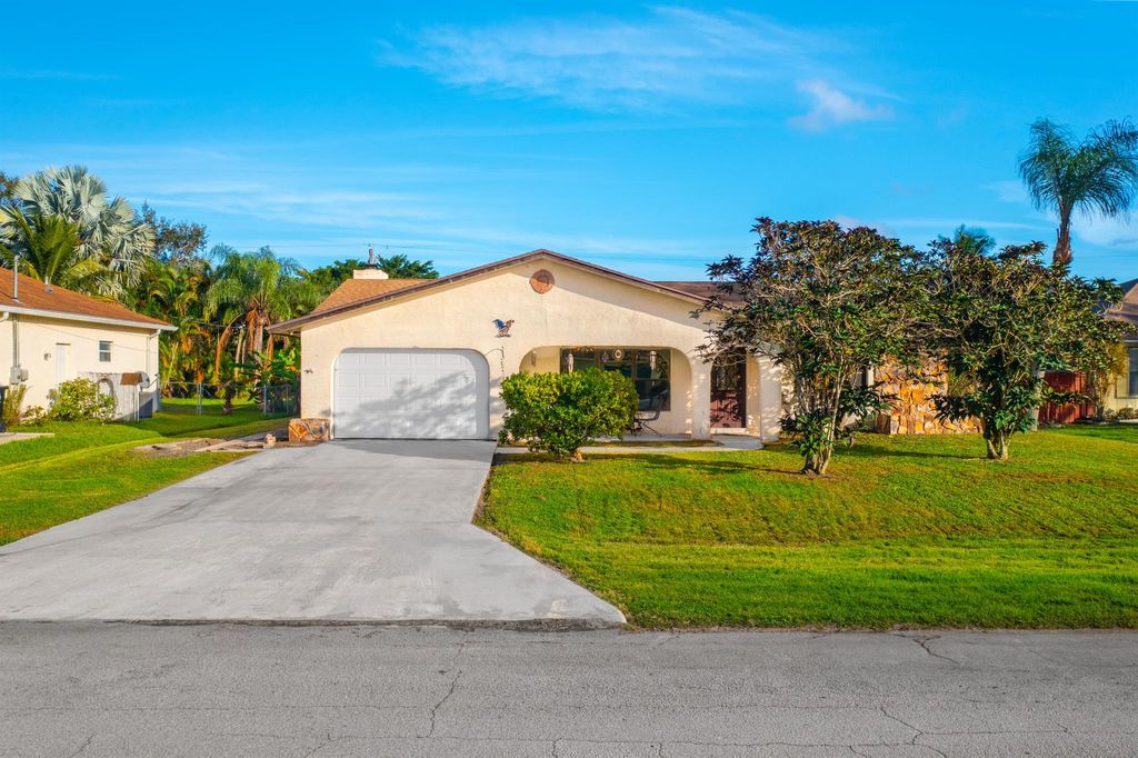 Photo of 1949 SE Cheltenham Street, Port Saint Lucie, FL 34983 (MLS # R10938691)