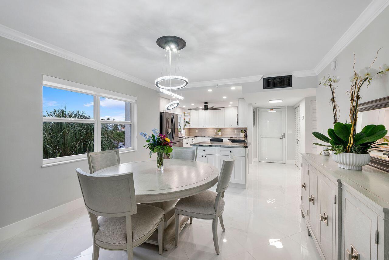 Exquisitely Remodeled 2/2 CORNER by Famed Interior Designer. Everything is new from head to toe.This Property includes: Modern Luxury Decor. Full Hurricane Impact Windows and Balcony Sliders, Covered Parking in Front of C Bld, White Vein Large Porcelain Tile,  New OPEN Kitchen with New Stainless Steel Appliances, Custom Ice Cube Maker in Freezer,New Self Closing Cabinetry, Quartz Countertops, Luxurious Remote Operated Window Treatments, Newer AC, NEW HWH, Smooth Ceilings, Updated Electrical, New Bathrooms with Light up / Heated Vanity Mirror, SMART Feature Blue Tooth, large custom walk-in closet with cabinetry, built ins & fresh paint. Washer and Dryer(2022) in the unit. All aspects of the CORNER RESIDENCE remodel were accomplished with sophistication with upmost attention to Detail