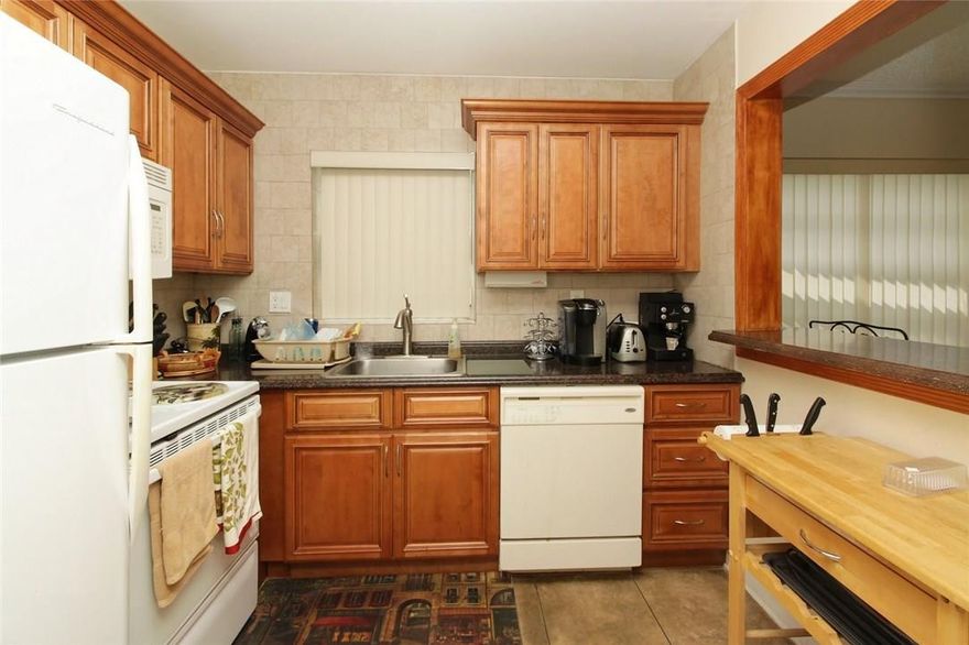 Just bring your toothbrush. 2/2 55+ community. Completely remodeled corner w/ wrap around balcony. Completely updated kitchen,bath,floors,Newer A/C. Best view Best Price. Easy to show. Can be sold furnished. Perfect pool and garden views. Have to see in person to believe. Building has an elevator and washer and dryer in each floor. Best deal in Quail Run.