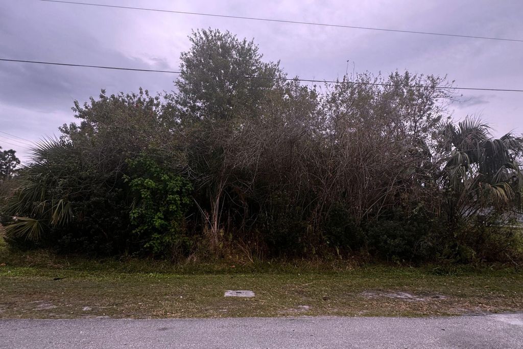 Photo of 3702 SW Darwin Boulevard, Port Saint Lucie, FL 34953 (MLS # R11167583)