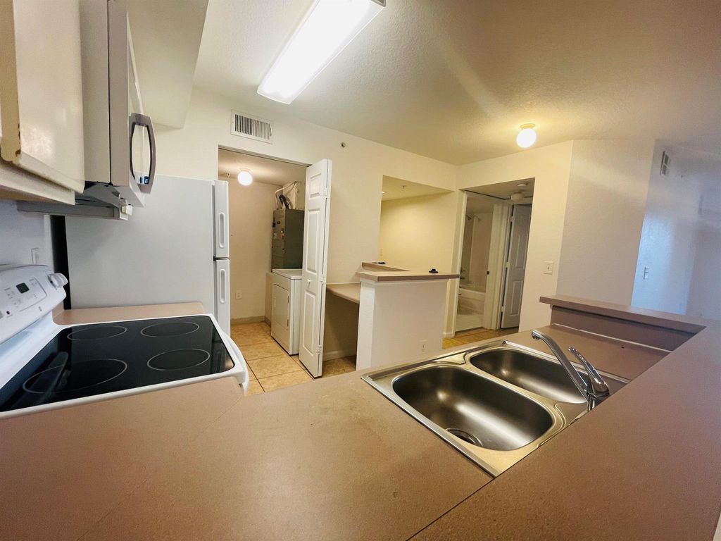 Photo of 171 SW Palm Drive #206, Port Saint Lucie, FL 34986 (MLS # R11050012)