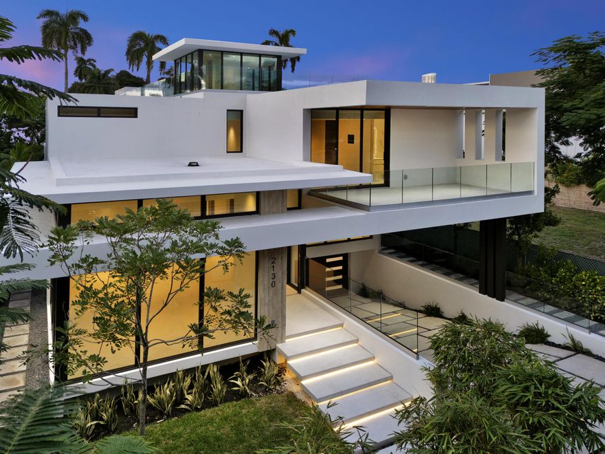 One-Of-A-Kind, 17' above the sea elevation. Experience unmatched luxury and modern refinement. This luxury residence exemplifies architectural excellence, innovative technology, timeless design. This architecturally striking residence offers 5,765 SF & over 11,000 +/- SF total, blending bold design with elevated living. The home features private storage & a six-car garage. Designed for effortless indoor-outdoor living, the open-concept living & dining, Expansive Island anchors this showpiece kitchen. It features Gaggenau, Wolf appliances, Sub-Zero and two outdoor kitchens. Scavolini Italian cabinetry. The 2nd floor offers generous bedroom suites with walk-in closets/spa-inspired bathrooms and family room. Roof Top that overlooks Miami skyline, Impact/Thermal windows & doors, gated entry.