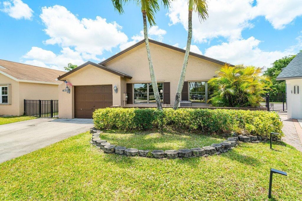 Photo of 9100 Pine Springs Drive, Boca Raton, FL 33428 (MLS # R11085862)