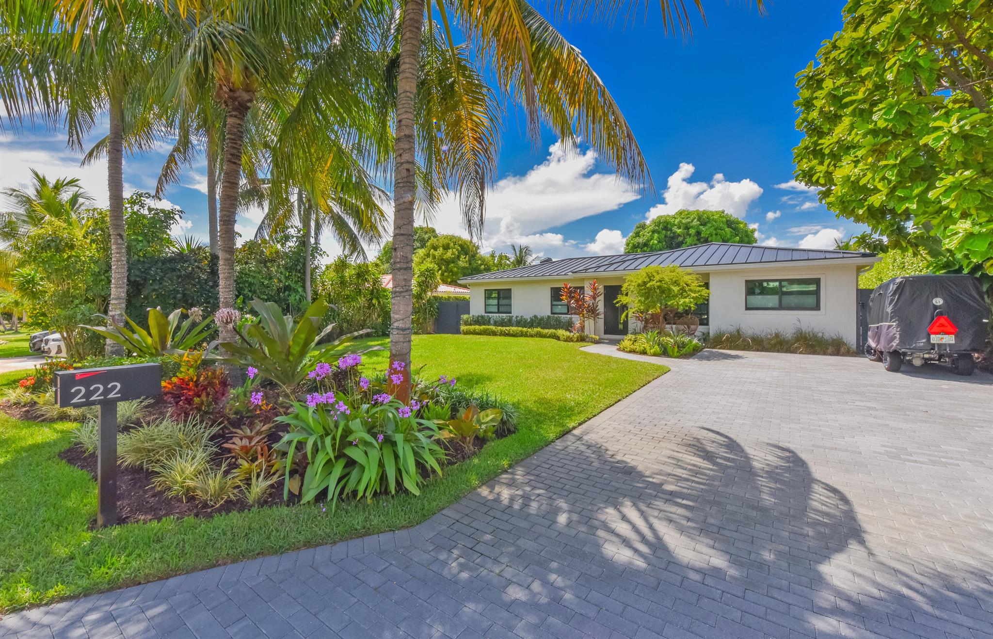 Welcome to 222 NE 17th St!This stunning 4/2 home, sitting on a .24 acre lot, is a quick golf cart ride to downtown, Atlantic Avenue's shops, restaurants, and nightlife, as well as the beach!222 boasts a new metal roof (2024), new impact windows and doors (2024), new impact sliders that open up to the incredible backyard oasis, new pool and spa (2024), new beautiful deck, new screened in/tiled patio, open kitchen, new kitchen appliances (2024), new washer/dryer (2025), new driveway, new landscaping, electric car charger (2025), outdoor shower, fruitful mango tree, and stunning landscape lights!17th street is a highly coveted address, with several new multi million dollar offerings, as it does not connect 2nd and 3rd avenues, so there is very little non local traffic!