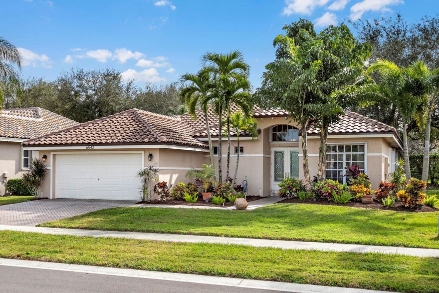 See this exquisite home located in the gated 55-plus community of Sandhurst at Jog Estates. This two-bedroom, two-bathroom home includes a large, accommodating great room, sizable office/den, and two-car garage. The sliders in the great room lead to the screened-in lanai that overlooks the private yard (no neighbors behind this home). The remodeled kitchen offers a spacious and charming French provincial chef's style with custom cabinets, Quartz counter-tops, an extra storage island, heavy-duty pull-out organizers in most bottom cabinets, a pull-out spice rack, tray rack, a spacious pantry, soft closing drawers and doors, and so much more. The primary bedroom offers a magnificent large remodeled En Suite. A must-see to genuinely appreciate the custom cabinetry, porcelain tile details, large garden tub, spacious shower, dual vanities with Quartz counters, and other meticulous custom details. You will find neutral colors throughout this home, tile floors in all living spaces, newer upgraded carpet in the two large bedrooms, a new roof (April 2021), accordion hurricane shutters for all windows and outside the screened lanai, crown molding in most rooms, an interior laundry room, a tankless water heater, a Reme Halo three-in-one home climate system, UV light for the HVAC heat pump, and a portable emergency generator. This is a well-cared-for, comfortable home with many thoughtful upgrades and the option to purchase with or without furnishings (inquire for details). Sandhurst at Jog Estates is a peaceful community with only 104 homes with low HOA fees offering newly paved roads, a Har-Tru tennis court, a recently re-finished pool, spa hot tub, gym, and clubhouse, and conveniently located next to the Shoppes of Woolbright which includes Publix, Walgreens, multiple banks, restaurants, and many other conveniences.