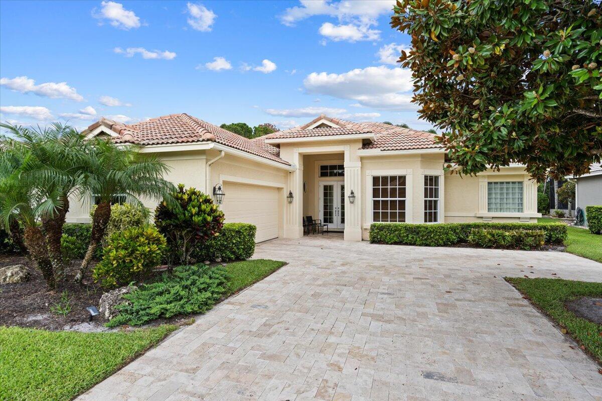 Step into this desirable St. Andrews Model in the sought-after Cypress Point neighborhood of PGA Village, offering 3 bedrooms, a den, and 2.5 bathrooms with a layout that's both functional and inviting. Freshly painted and move-in ready, the open-concept living space is enhanced by 10-foot sliders that invite natural light and open to a beautiful outdoor retreat. A sparkling screened-in blue pool with a newer heater sets the stage for year-round enjoyment, while the extended covered patio offers the perfect shaded space for alfresco dining or relaxing with family and friends. FULL IMPACT GLASS throughout adds peace of mind and energy efficiency. HOA dues include basic cable, internet, lawn care, and manned gate security.