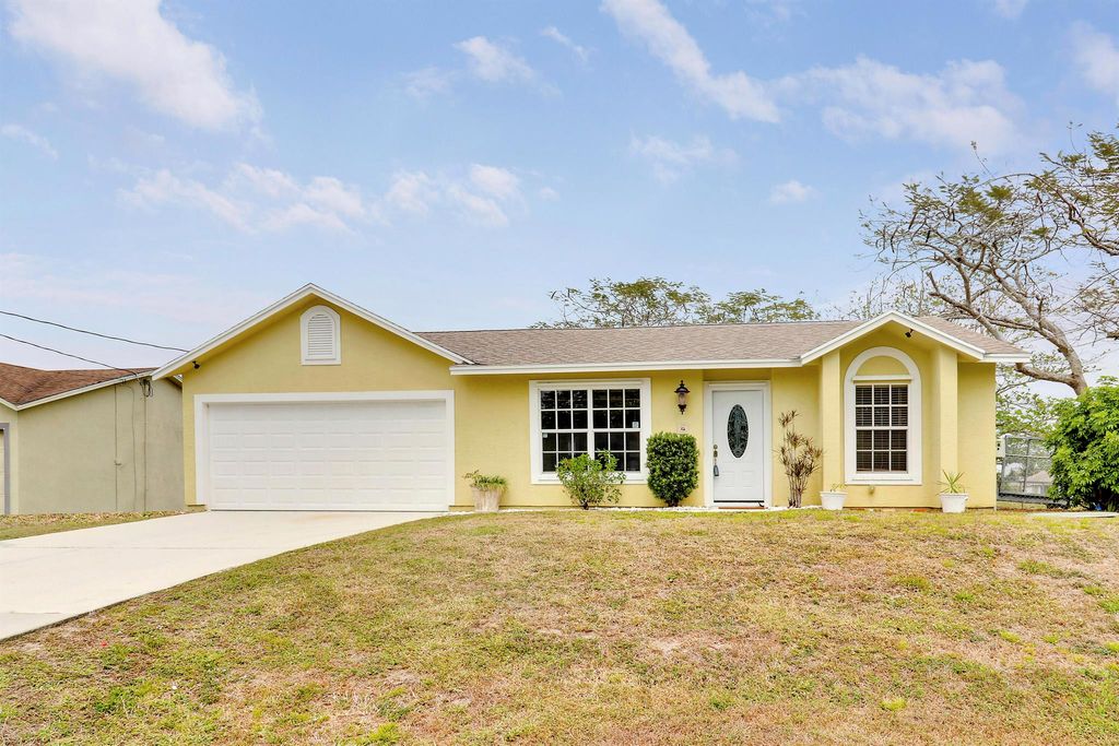 Photo of 409 SW North Quick Circle, Port Saint Lucie, FL 34953 (MLS # R11074036)