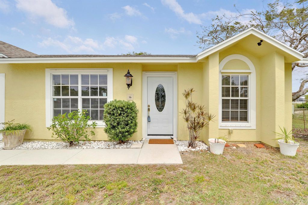 Photo of 409 SW North Quick Circle, Port Saint Lucie, FL 34953 (MLS # R11074036)