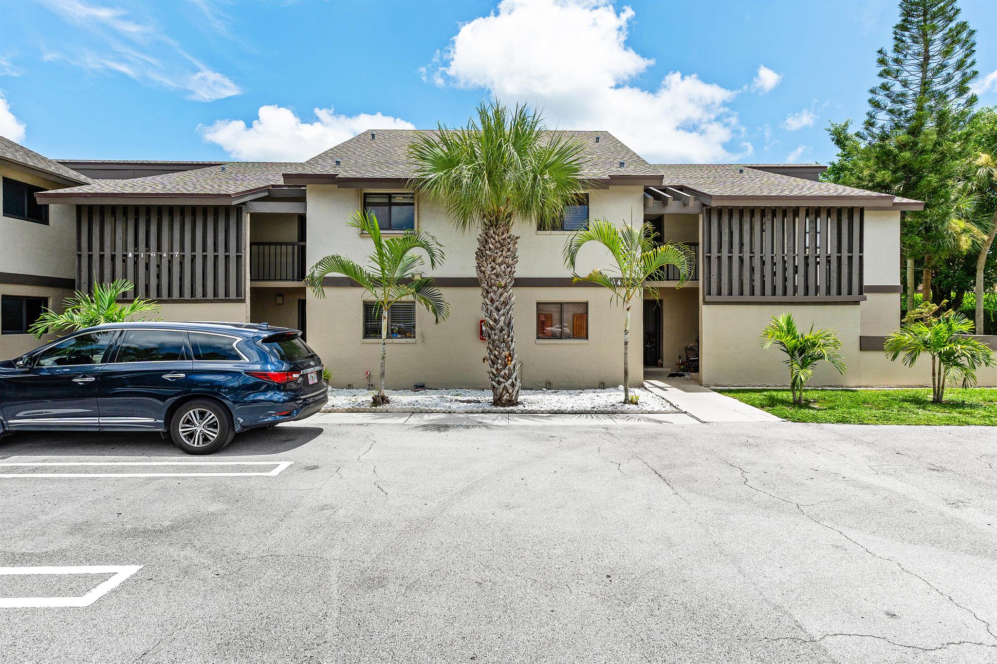 This bright and well-maintained 3-bedroom, 2-bathroom unit offers comfortable living with tile floors throughout, an open-concept layout, and two private balconies for relaxing or entertaining. The large kitchen features stainless steel appliances and flows seamlessly into the dining area and spacious living room.Enjoy the convenience of an in-unit washer and dryer, two assigned parking spaces, and additional overflow parking available across the street--perfect for guests or extra vehicles. Work vehicles are allowed, making this a rare find for those with business needs. Please note: No pets allowed.This move-in ready home combines practicality and style in a well kept community. It is also within walking distance to Scotts Place Playground. Schedule your showing today!