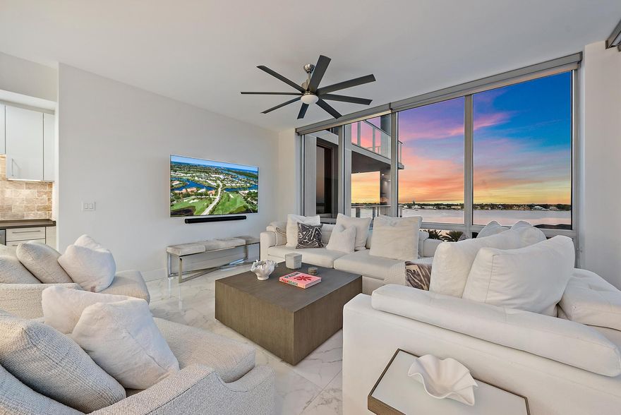 Resort-style waterfront living with stunning southeast exposures from the highly sought-after Cobalt model in the desirable South Tower at the Water Club. This spacious 2-bedroom, 2.5-bath residence with a den offers sweeping views of the wide Intracoastal Waterway—waterfront living at its finest. Built in 2016, this residence features floor-to-ceiling impact glass windows and sliders that open to a generous outdoor terrace, ideal for relaxing or entertaining while enjoying the water views. Inside, the modern European-style kitchen is outfitted with JennAir stainless steel appliances and flows seamlessly into an open-concept living and dining area with nearly 2,000 square feet of light-filled living space. Sleek 24" porcelain tile flooring runs throughout, complemented by custom window treatments.

The primary suite offers a spa-inspired bath with dual vanities, frameless glass shower enclosures, and custom-designed closets. A versatile den functions beautifully as a home office, media room, or guest space.

The Water Club delivers an incomparable resort lifestyle with luxury amenities including a private club, guest suites, day dock, fire pits, event lawn, pickleball court, two state-of-the-art fitness centers, yoga studio, two resort-style pools, a dedicated lap pool, and two hot tubs. Residents enjoy gated entry, spacious underground garage parking, individual storage units, secured private elevator access, attentive concierge services, and 24/7 securityproviding both peace of mind and true full-service luxury living.

Ideally located just minutes from premier shopping, dining, and beaches, and approximately 20 minutes from Palm Beach International Airport. Pet-friendly community with large dogs welcome and a dedicated dog park area.