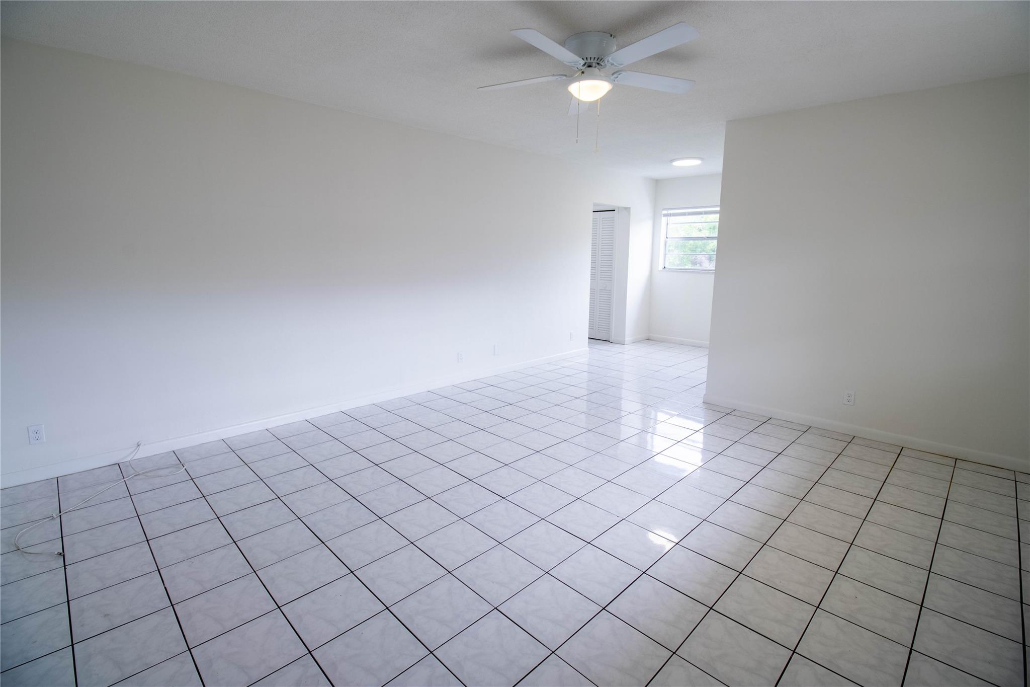 This second-floor corner apartment offers ample space and features one bedroom and one bathroom with a newly renovated kitchen! The unit boasts full tiling throughout, and the bedroom includes wall-to-wall closets. The bathroom is generously sized and includes a linen closet, while an additional hallway closet adds to the storage options. The living room is also impressively spacious.