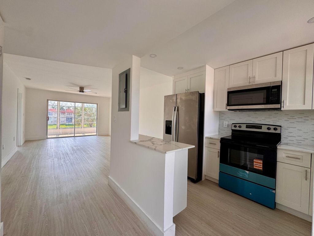 Photo of 2831 E Sunrise Lakes Drive E #311, Sunrise, FL 33322 (MLS # B26042428)