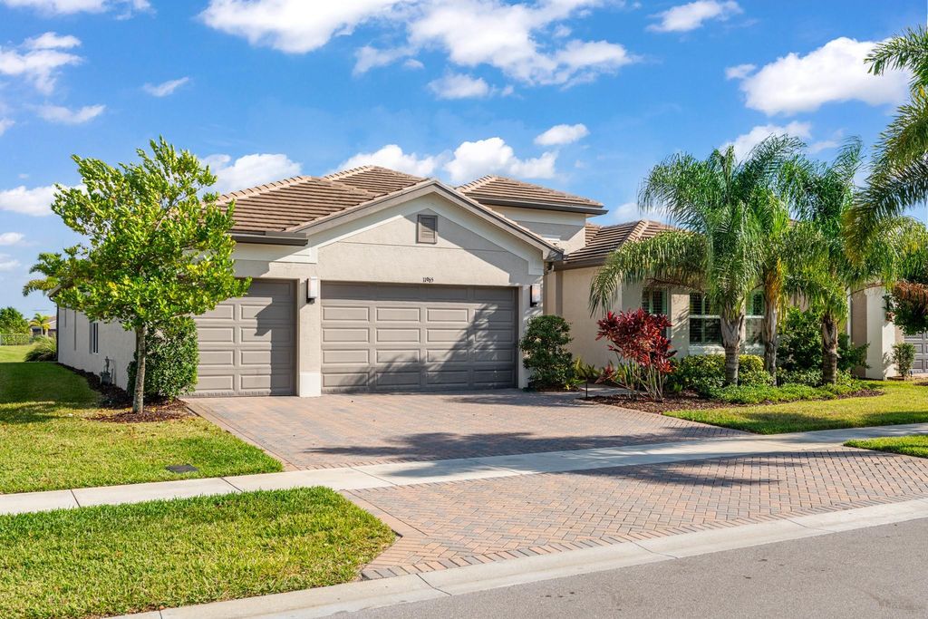 Photo of 11965 SW Sandy Bay Cir, Port Saint Lucie, FL 34987 (MLS # F10540283)