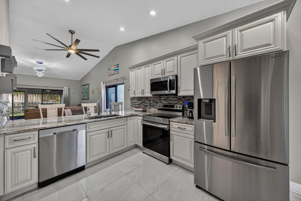 Photo of 1036 E Lakes Drive, Pompano Beach, FL 33064 (MLS # B26029985)