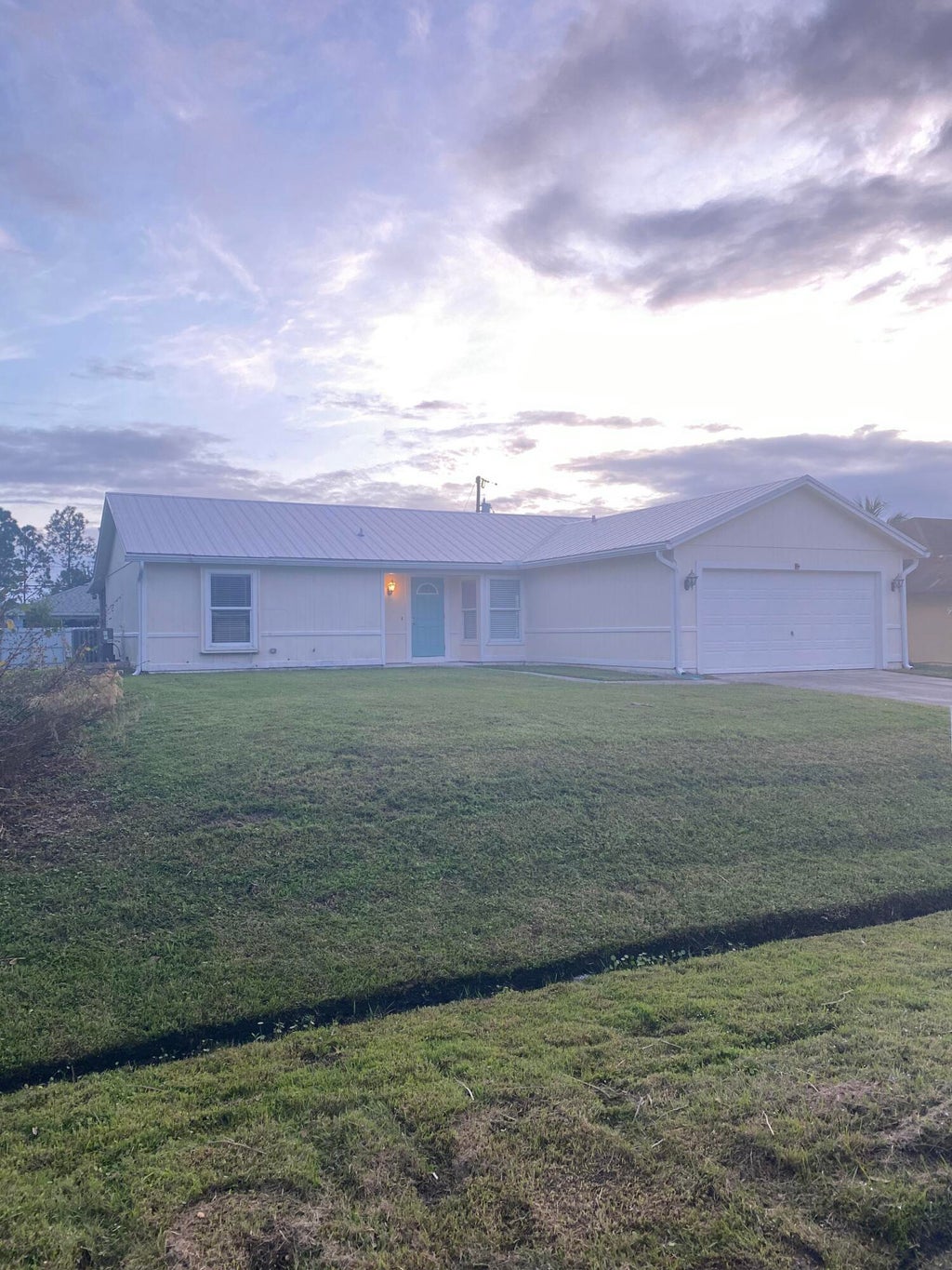 Photo of 1866 SW Effland Avenue, Port Saint Lucie, FL 34953 (MLS # B26078485)